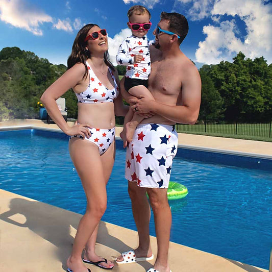 Family wearing matching swimsuits